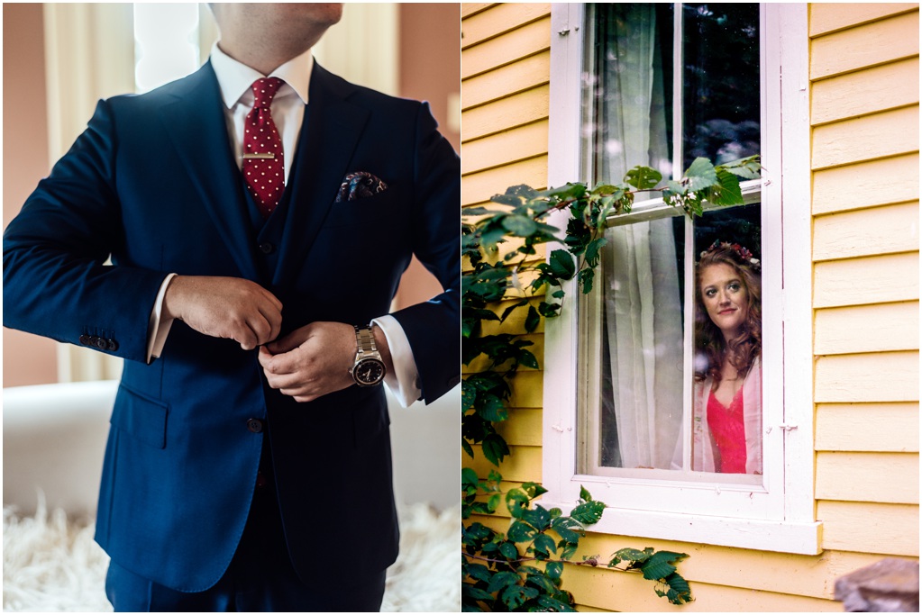 The groom buttons his jacket. The bride looks through the curtains to the outside of the yellow Victorian house.