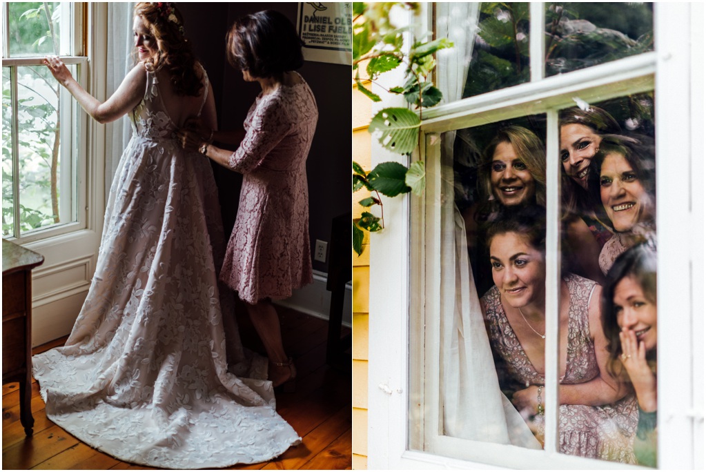 The bride's mother fastens her dress. The bridesmaids look out the window.