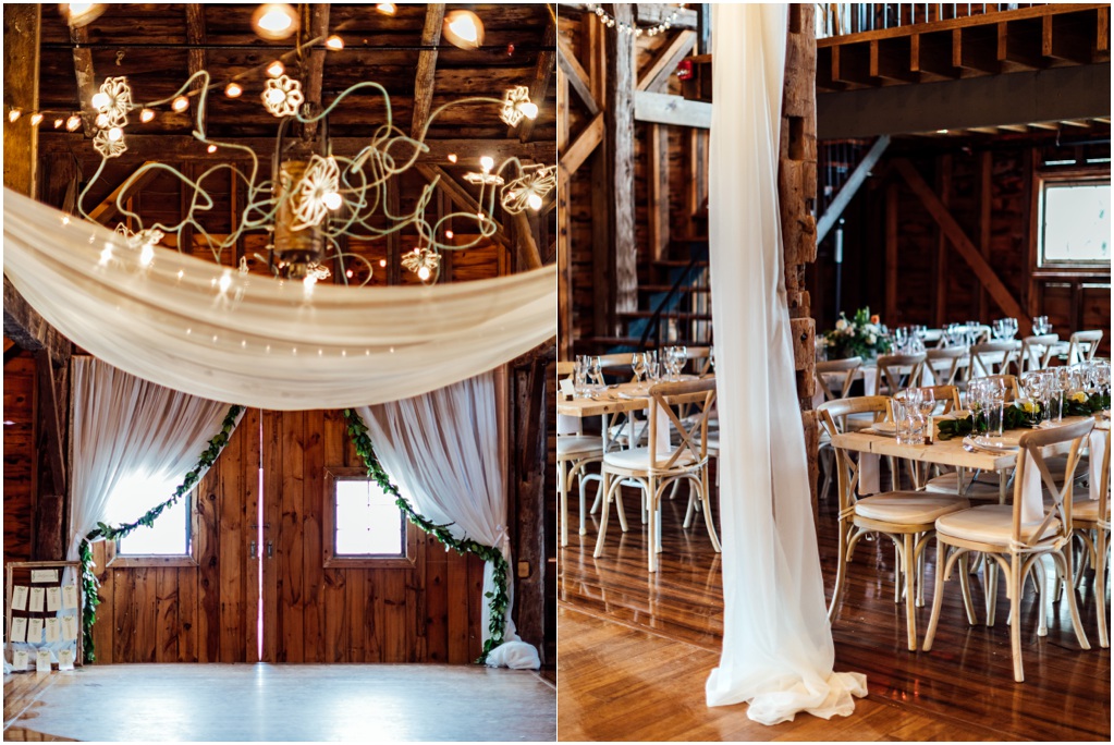 The interior of the barn is decorated with white fabric and strings of lights