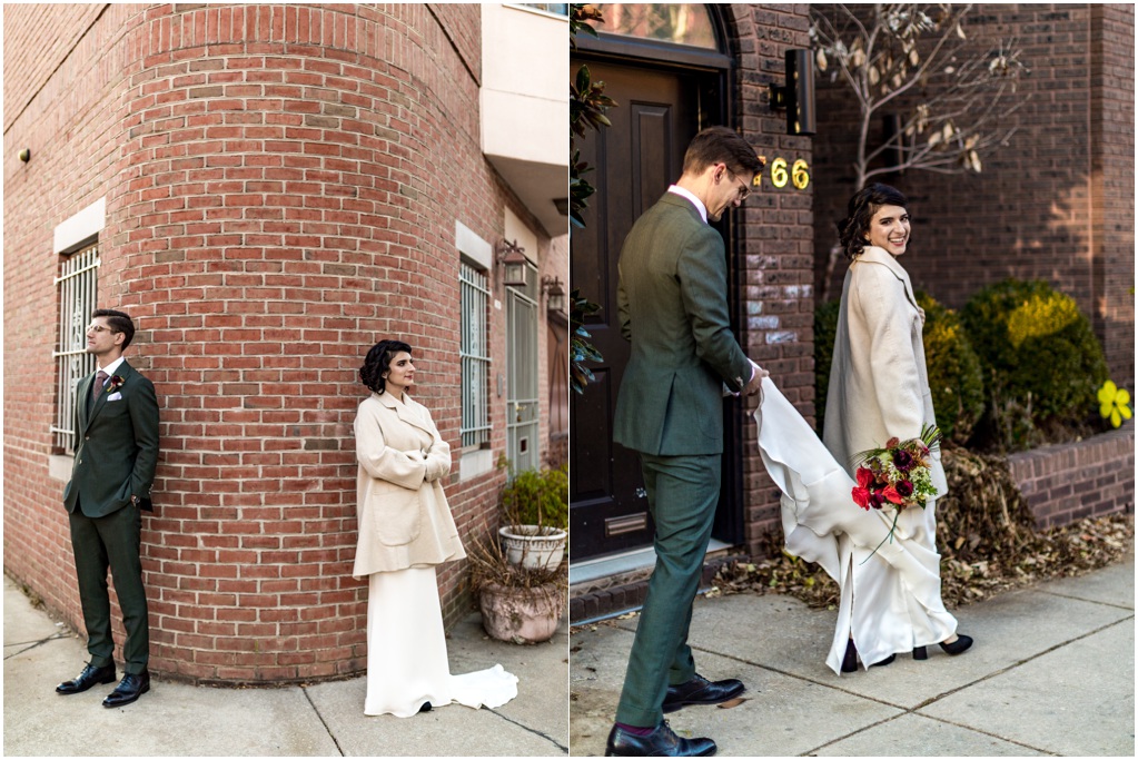 The couple walks down the street and poses on a corner.