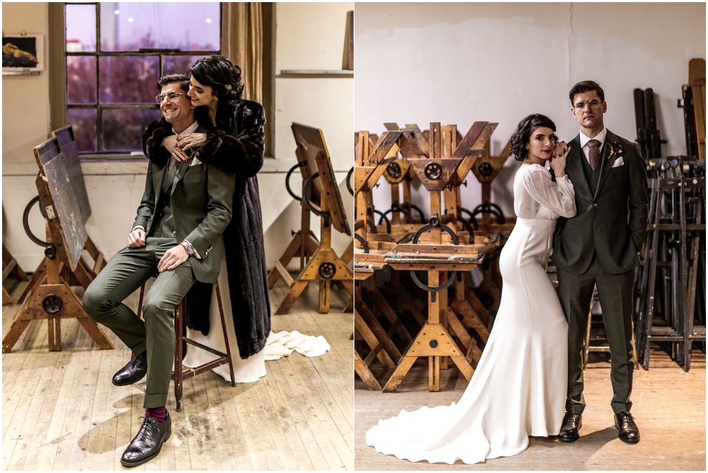 The couple poses in an art studio with easels behind them.